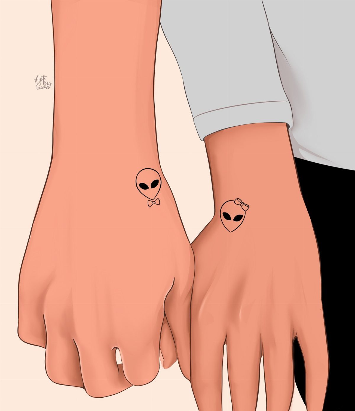 Two wrists with matching alien head tattoos, one with a bow tie and one with a bow.