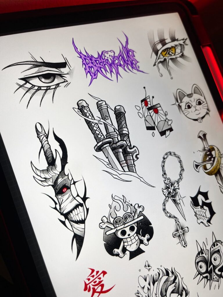 Tattoo flash designs on a tablet screen featuring swords, eyes, and a skull.